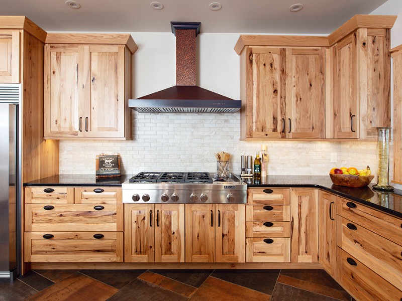 beaver-mountain-log-homes-kuyahoora-lodge-cedar-hybrid-home-kitchen-stove-1