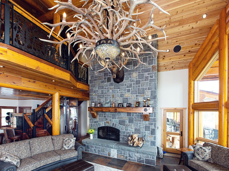 beaver-mountain-log-homes-kuyahoora-lodge-cedar-hybrid-home-living-area-fireplace-1