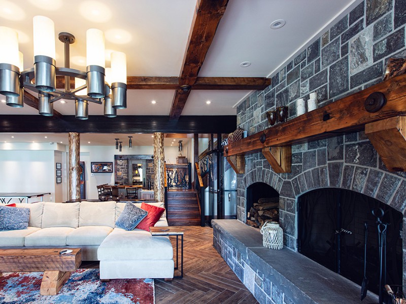 beaver-mountain-log-homes-kuyahoora-lodge-cedar-hybrid-home-stone-fireplace-1